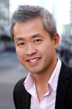 Man with short hair smiling